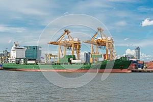 Container Cargo freight ship with working crane bridge