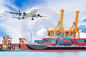 Container cargo freight ship with working crane loading bridge