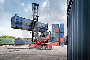 Container Cargo Port Ship Yard Storage of Logistic Transportation Industry. Forklift is Stacking Containers of Freight Import/