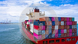 Container cargo ship carrying container for business freight import and export, Aerial view container ship arriving in commercial