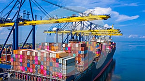 Container cargo ship at industrial port in import export business logistic and transportation of international by container cargo