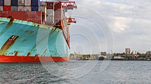 Container cargo ship load in the seaport. Logistics and transportation of Container Cargo ship with working crane bridge in