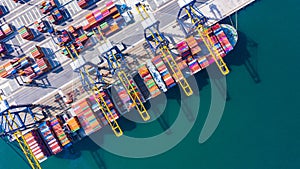 Container cargo ship  loading in a port, Aerial top view container cargo ship