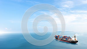 Container cargo ship in the ocean at sunset blue sky background with copy space, Nautical vessel and sea freight shipping