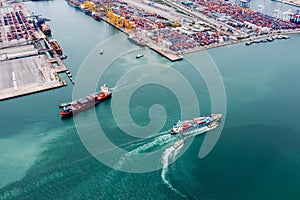Container cargo ship sailing in green sea to transport of goods import export internationally or worldwide business and industrial