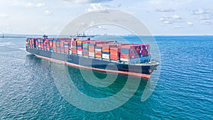 Container , container ship in export and import business and logistics. Shipping cargo to harbor by crane. Water transport