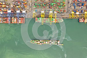 Container , container ship in export and import business and logistics. Shipping cargo to harbor by crane. Water transport