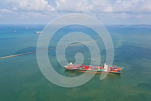 Container , container ship in export and import business and logistics. Shipping cargo to harbor by crane. Water transport