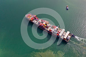 Container , container ship in export and import business and logistics. Shipping cargo to harbor by crane. Water transport