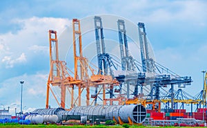 Container crane cargo freight ship with working crane loading bridge containers in shipyard at dock yard for logistic import and e