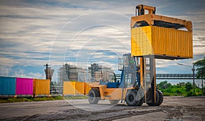 Container crane cargo freight ship with working crane loading bridge containers in shipyard at dock yard for logistic import and e