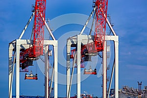 Container cranes at shipyard big heavy technique for unloading containers.