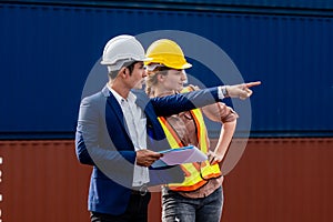 Container Depot chief talking to female foreman about custom document of the goods inside Empty Container depot