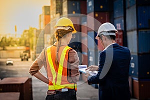 Container Depot chief talking to female foreman about custom document of the goods inside Empty Container depot