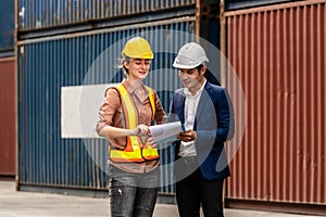 Container Depot chief talking to female foreman about custom goods packing list documents