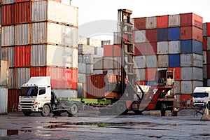 container forklift and the truck is waiting for the container. in the container yard