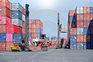 Container handlers are loading containers into trucks
