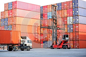 Container handlers and trucks In the loading and unloading yard