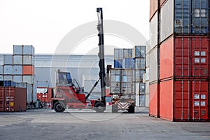 Container handlers and trucks work simultaneously. In the transportation of goods