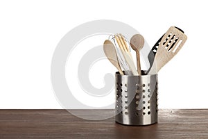 Container with kitchen utensils