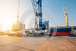 Container loading in a Cargo freight ship with industrial crane. Container ship in import and export business logistic company. In