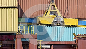 Container loading in a Cargo freight ship with industrial crane. Container ship in import and export business logistic company.