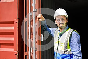container logistic operators workers wearing yellow helmets and reflection shirts and open containers for inspection and check the