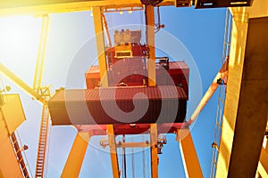 Container logistics, quay crane load and unload cargo container from vessel. Port operations.