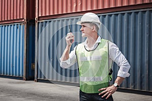 Container Logistics Shipping Management of Transportation Industry, Transport Engineer Control Via Walkie-Talkie to Worker in