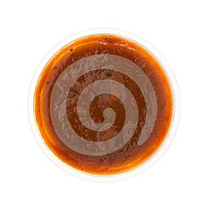 Container of marinara sauce on a white background