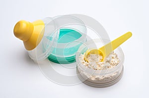 Container of powdered milk for infants on white background