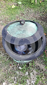 A Container Rubbish with tire used material in the garden a with natural Background