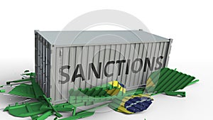 Container with SANCTIONS text breaks cargo container with flag of Brazil. Embargo or political export or import ban