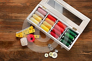 Container with set of color sewing threads