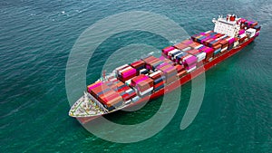 Container ship carrying container for business logistic freight import and export, Aerial view container ship arriving in