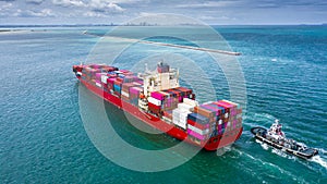 Container ship carrying container for business logistic freight import and export, Aerial view container ship arriving in
