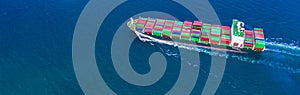 Container ship carrying container for import and export, business logistic and transportation by ship in open sea, Aerial view