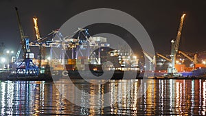 Container ship at deep sea port at night, Business import export logistic and transportation of International by