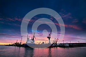 Container ship docked at industrial port. Sunset silhouettes cranes, vessel ready for global trade. Maritime cargo