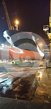 A container ship is in drydock after all works of being done and ready for sea