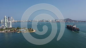 A container ship enters the harbor of Cartagena Colombia aerial view.