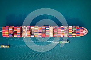 Container ship in export and import business and logistics. Aerial view