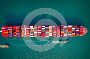 Container ship in export and import business and logistics. Aerial view