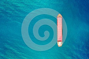 Container ship in export and import business and logistics. Shipping cargo to harbor. Water transport International. Aerial view