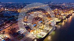 Container ship in import export and business logistic, International transportation, Business logistics concept,Aerial night view.