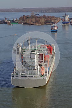 Container ship near a floodgate photo