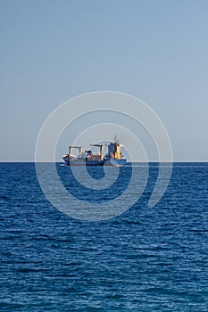 Container ship leaves a port.