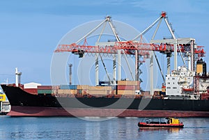 Container ship is loading at the port.