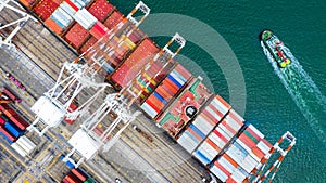 Container ship  loading in a port, Aerial top view container ship in business import export transportation logistic