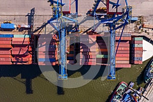 Container ship loading and unloading in port, Aerial view of logistic import and export freight transportation by container ship